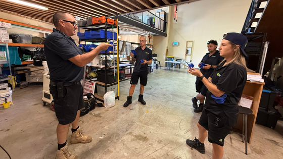 Advance You trainers delivering hands-on pest management training in a workplace setting