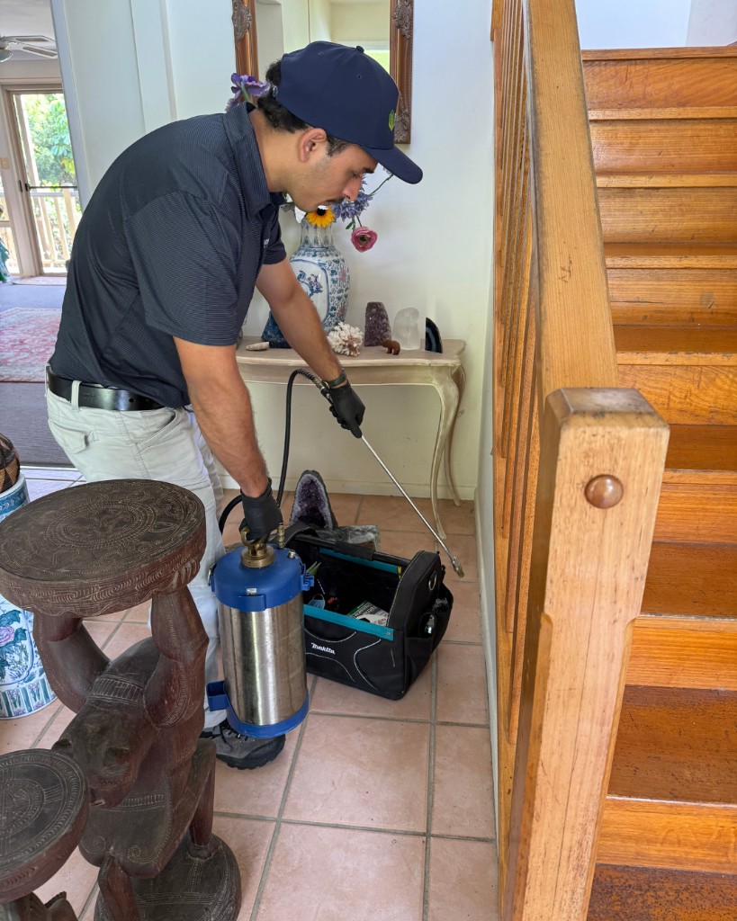 Technician applying a general pest treatment during Ride & Learn training